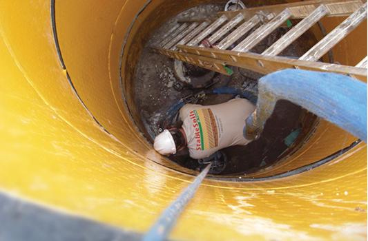 Man repairing a manhole