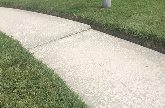 Concrete sidewalk with a lift