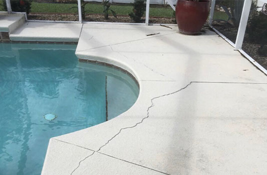 Concrete next to pool cracked
